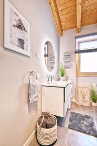 a bathroom with a sink and a mirror at Apartment Monti e Lago - Tignale in Tignale
