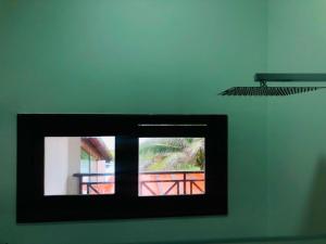 a picture of a window in a room at Villa Ava Kite - Guajiru in Trairi