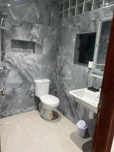 a bathroom with a toilet and a sink at Appartement City Agadir 2 in Agadir