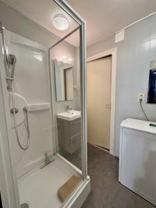 a bathroom with a shower and a sink at Brive Republique in Brive-la-Gaillarde +35 photos