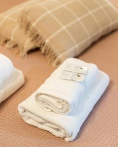 a pile of white towels sitting on a table at Saint Marco35th in Braşov +136 photos