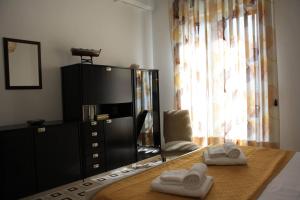 Posteľ alebo postele v izbe v ubytovaní Archimede Lounge + 22 fotografií