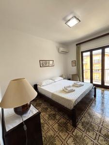 Posteľ alebo postele v izbe v ubytovaní Archimede Lounge