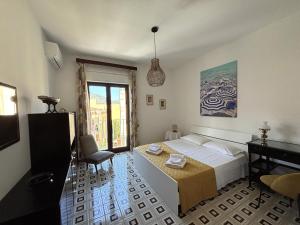 Posteľ alebo postele v izbe v ubytovaní Archimede Lounge