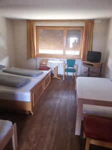 Postel nebo postele na pokoji v ubytování Pension & Restaurant TsingDao