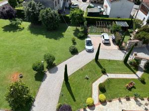 an aerial view of a park with cars parked at Rustico del Chiasso - Villa With Private pool near Lucca in Lucca