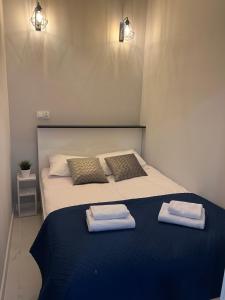 Ένα ή περισσότερα κρεβάτια σε δωμάτιο στο Apartamenty Sienkiewicza 41