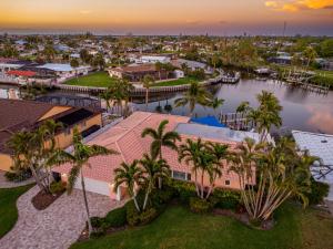 an aerial view of a resort with palm trees at Whispering Palms! Private canal side dock and pool with spa! in Bradenton