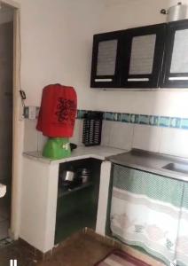 Η κουζίνα ή μικρή κουζίνα στο Suites&Flats Galinhos