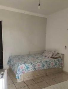Ένα ή περισσότερα κρεβάτια σε δωμάτιο στο Suites&Flats Galinhos