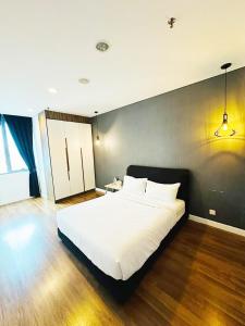 Postel nebo postele na pokoji v ubytování The Summer Suite KLCC