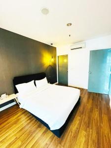 Postel nebo postele na pokoji v ubytování The Summer Suite KLCC