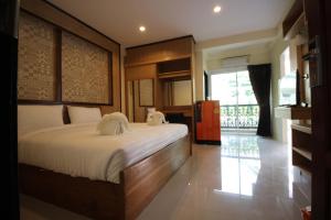 Кровать или кровати в номере Monmuang