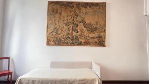 Postel nebo postele na pokoji v ubytování Papavero Piazza Delfino