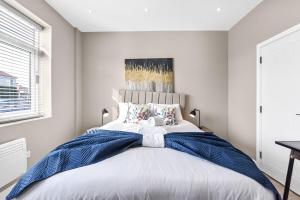 Ένα ή περισσότερα κρεβάτια σε δωμάτιο στο Studio Society - Stay, Cook, and Connect