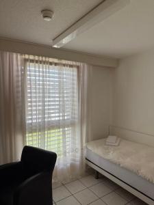 Postel nebo postele na pokoji v ubytování Hotel Lötschberg