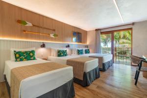 Postel nebo postele na pokoji v ubytování Resort Tororomba + 37 fotografií