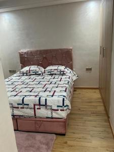 a bedroom with a large bed in a room at appartement de lux vue piscine 5 min plage bouznika in Bouznika +24 photos