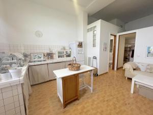 a kitchen with a table with a basket on it at Studio La Caleta De Interian Garachico in Caleta de Interián