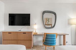 a room with a desk and a mirror at Top Floor Studio with Balcony & Views 3528 in Honolulu