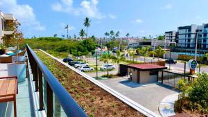 a balcony with a view of a parking lot at Malia Beach in Ipojuca