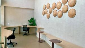 an office with two desks and two chairs in a room at Malia Beach in Ipojuca +26 photos