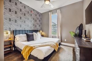 a bedroom with a bed and a window at The Tennessee Whiskey in West End-Vandy- Uber to Broadway in Nashville