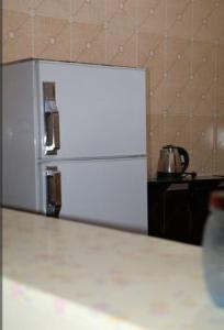 Kuchyň nebo kuchyňský kout v ubytování sun smile guest house᭄ꦿ