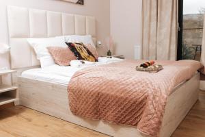 Ένα ή περισσότερα κρεβάτια σε δωμάτιο στο Apartamenty IDA - Belle View