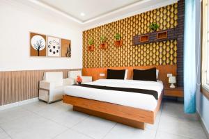 Ένα ή περισσότερα κρεβάτια σε δωμάτιο στο Hotel O KK Inn