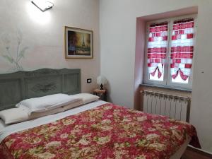Posteľ alebo postele v izbe v ubytovaní Il Ciliegio di Lurisia