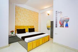 Ένα ή περισσότερα κρεβάτια σε δωμάτιο στο Hotel O K. P. Luxurios