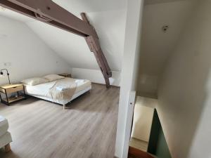 Postel nebo postele na pokoji v ubytování Le Cocon de Sens