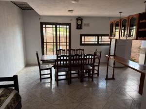 a dining room with a table and chairs at Casa Irigoyen in Deán Funes +8 photos