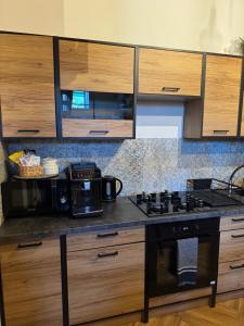 Kuchyňa alebo kuchynka v ubytovaní Dawna Mleczarnia Apartamenty LOFT
