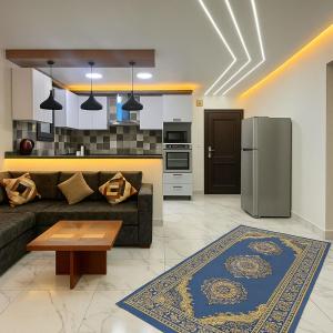 a living room with a couch and a refrigerator at Porto Said Chalets, your perfect family getaway destination in Port Said
