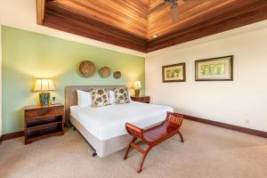 a bedroom with a bed and a wooden ceiling at Mauna Lani Villages 512 in Waikoloa +54 photos