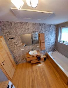 a bathroom with a toilet and a tub and a sink at Green Castle in Kunje +50 photos