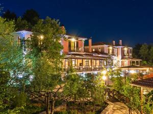 a large building with lights on it at night at Ilaeira Mountain Resort in Toriza