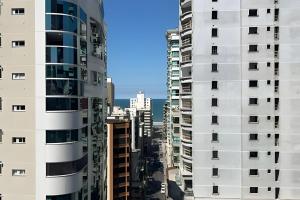 a view of a city with tall buildings at 3 Suítes | Gourmet Vista Mar | Próx. Russi Russi in Meia Praia