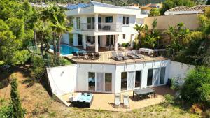 an aerial view of a house with a swimming pool at Villa -Heated pool -Amazing view -Ideal for groups in Mijas