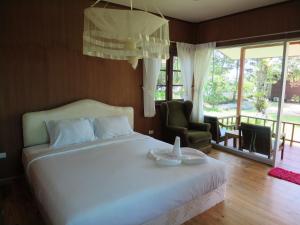 Postel nebo postele na pokoji v ubytování Bangbaobeach Resort
