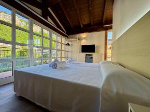 Un pat sau paturi într-o cameră la Corte Impero Hotel & Restaurant