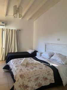 Ένα ή περισσότερα κρεβάτια σε δωμάτιο στο Tandilia Hills