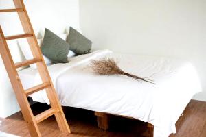 Postel nebo postele na pokoji v ubytování Artisan Hostel