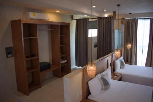 Postel nebo postele na pokoji v ubytování Joanza by ÓOL Hotels