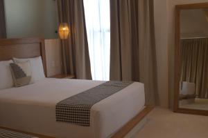 Postel nebo postele na pokoji v ubytování Joanza by ÓOL Hotels