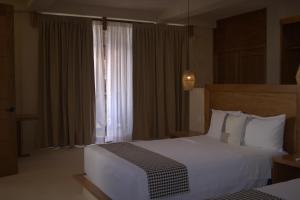 Postel nebo postele na pokoji v ubytování Joanza by ÓOL Hotels