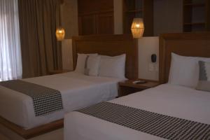 Postel nebo postele na pokoji v ubytování Joanza by ÓOL Hotels