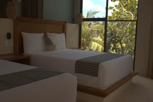 Postel nebo postele na pokoji v ubytování Joanza by ÓOL Hotels
